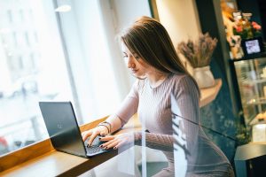 Girl remotely working at loft area 